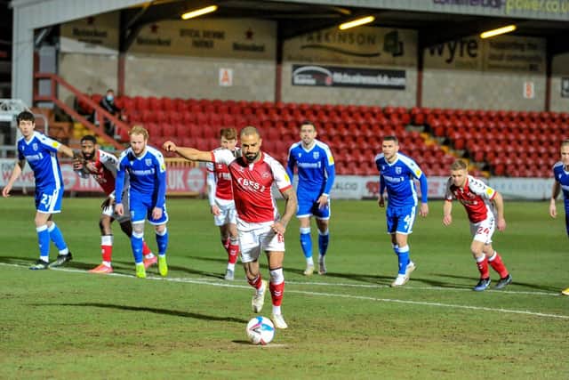Kyle Vassell converts the winning penalty early in the game against Gillingham