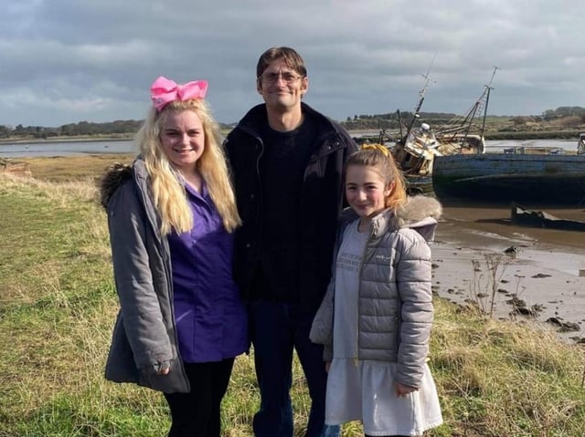 John Redmond with daughters Bethany (left) and Aysha