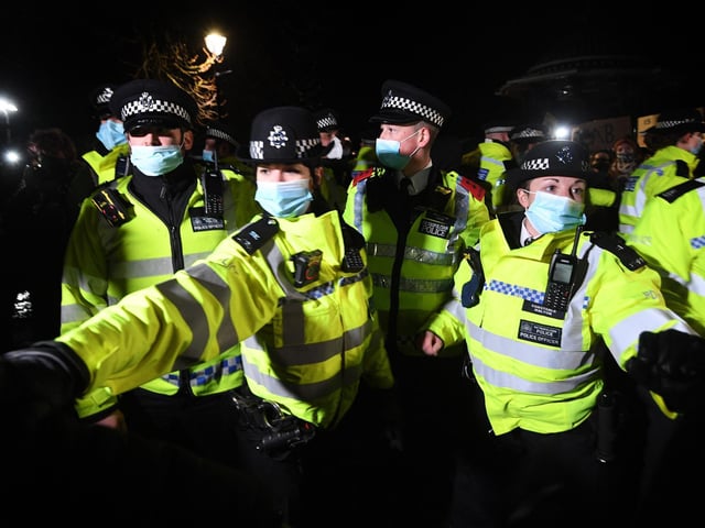 Police officers clash with people as they form a gathering in Clapham Common, London, after the Reclaim These Streets vigil for Sarah Everard was officially cancelled