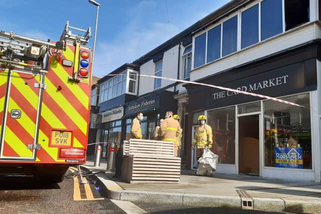 The person was lifted to safety from the first floor window of the Topping Street flat, above the formerCard Market shop, at 7.37am