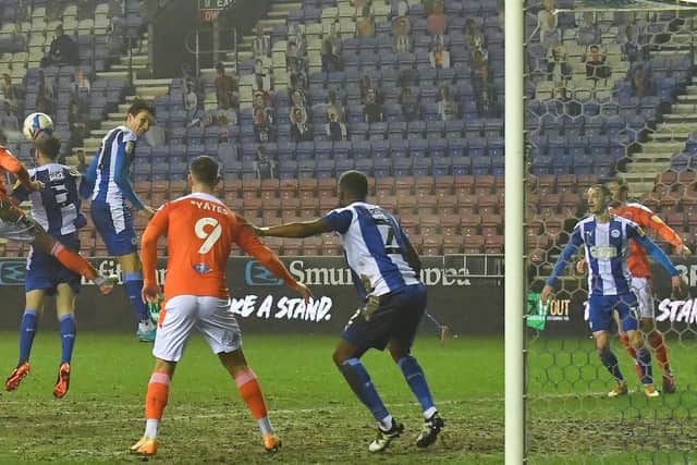 Gary Madine heads goalwards on his most recent appearance for Blackpool - the 5-0 win at Wigan Athletic in January