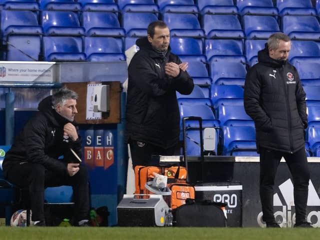 Colin Calderwood (centre) has helped Blackpool boss Neil Critchley to see the bigger picture this season