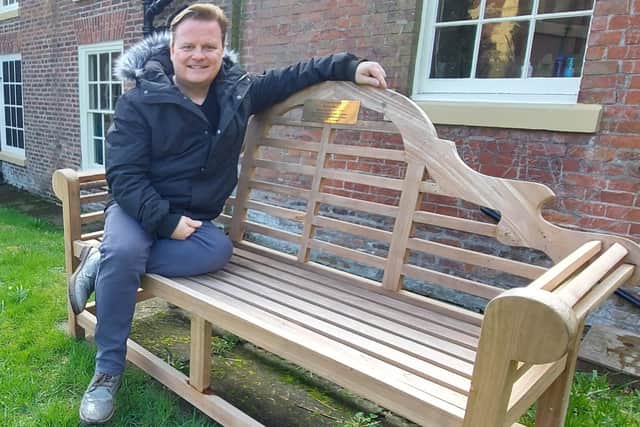 Lytham Hall assistant manager Paul Lomax at the Bobby Ball memorial bench