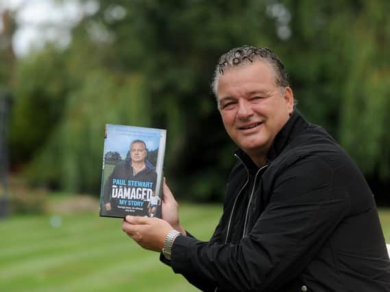 Paul Stewart with his autobiography Damaged in 2019