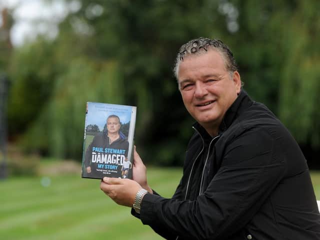 Paul Stewart with his autobiography Damaged in 2019