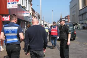 The Blackpool BID team out with police officers to keep the streets of the town centre looking better for visitors
