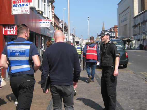 The Blackpool BID team out with police officers to keep the streets of the town centre looking better for visitors