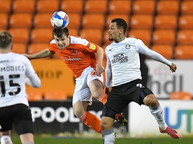 Jordan Thorniley beats Peterborough's 24-goal striker Jonson Clarke-Harris to the ball during Tuesday night's 3-1 win