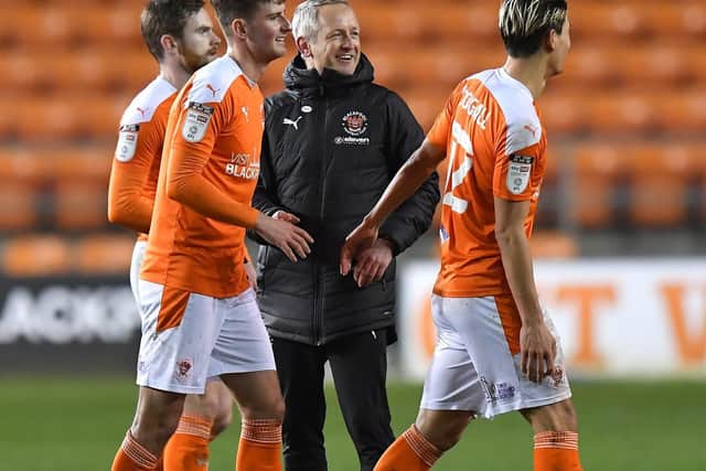 Neil Critchley congratulates his players after Tuesday's win over Peterborough