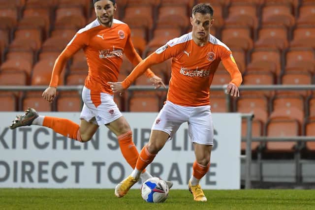 Two-goal Jerry Yates (right) and Luke Garbutt, Blackpool's other scorer against Peterborough on Tuesday