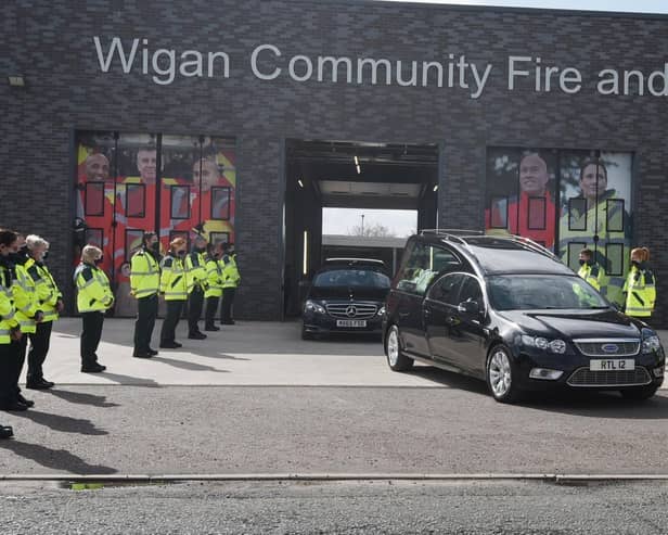 A guard of honour for Peter Millington's cortege at Wigan Fire and Ambulance Station