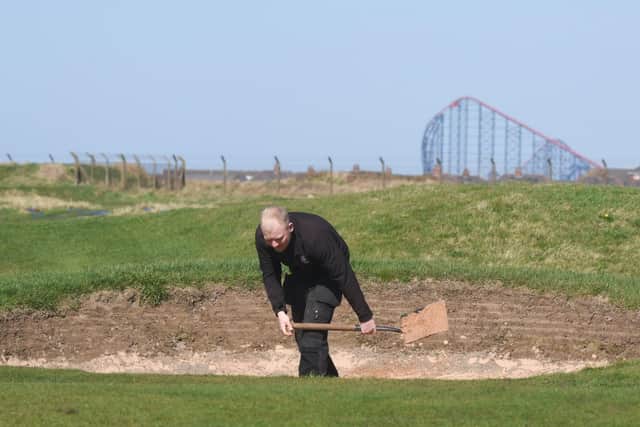 The course being prepared at St Annes Old Links golf club, with its backdrop of Blackpool's The Big One