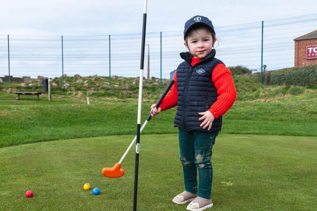 Two-year-old Alma Tracey was helping her dad make final preparations to the course at St Annes' Mini Links before its reopening on Monday