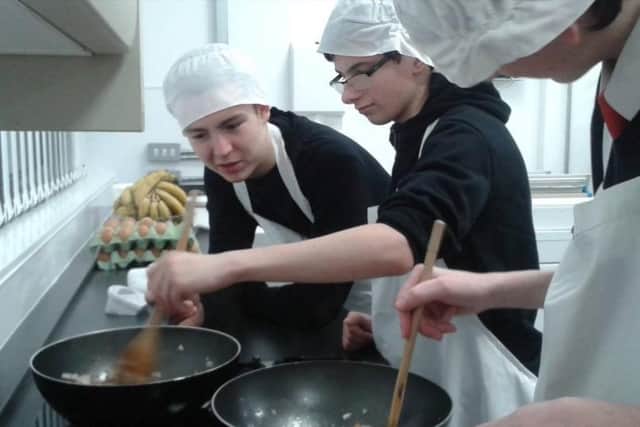 Young people at Aspired Futures learning how to cook