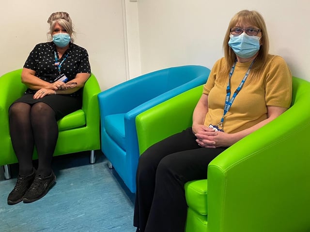 Medical Records department staff Julie Bonell (left) and Gail McBride enjoy their new seating. Photo: Blue Skies