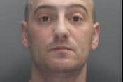 Christopher Averkiou is wanted in in relation to an investigation into threats to kill, assault and harassment (Credit: Lancashire Police)