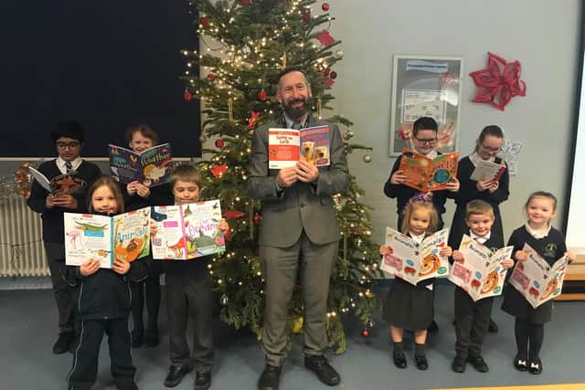 Roger Farley, headteacher at Westminster Primary School, Blackpool, with pupils and their new books
