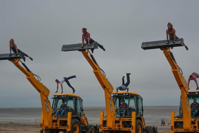 The dancing diggers on the beach at Fleetwood's SpareParts Festival in 2014