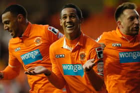 Tom Ince celebrates his deflected goal