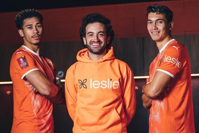 Blackpool players Jordan Gabriel (left) and Kenny Dougall (right) pictured with CEO and founder of Leslie, Joey Barnett.