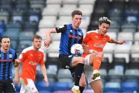 Jake Beesley in action for Rochdale against Blackpool last season