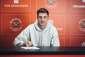 Jake Beesley signs his Blackpool contract which runs until the summer of 2025