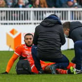 Keshi Anderson receives treatment at Hartlepool but had to leave the field before half-time