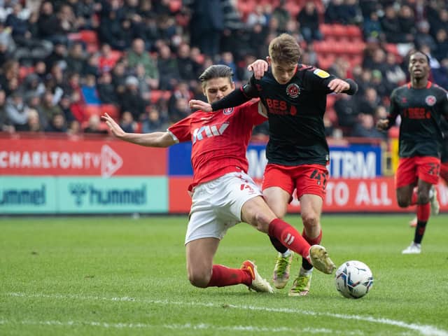 Fleetwood's Cian Hayes is challenged by George Dobson of Charlton