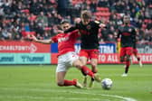 Fleetwood's Cian Hayes is challenged by George Dobson of Charlton