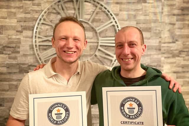 John (left) and James (right) with their Guinness Book of World Records certificates