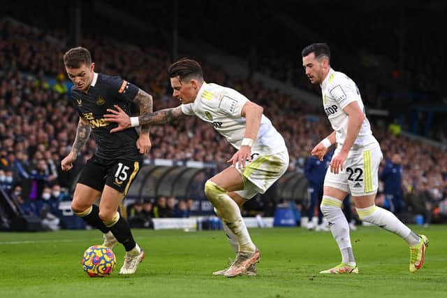 BOTTOM-HALF BATTLE: Newcastle United's Kieran Trippier, left, looks to hold off Leeds United's Robin Koch, centre, and Jack Harrison, right, in this month's Premier League clash at Elland Road. Photo by Stu Forster/Getty Images.