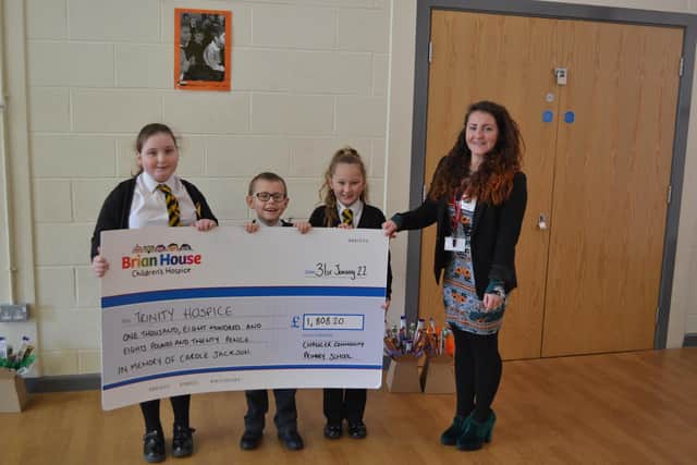 Chaucer Primary School's Oakley Porter, Toby Squires and Hermoine Squires with Lauren Codling from Trinity Hospice.