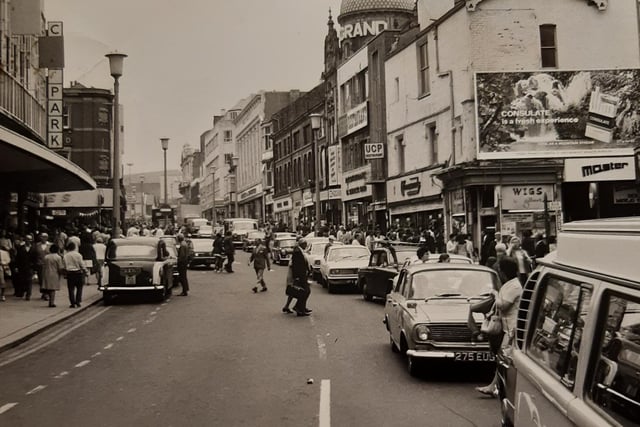 The town centre was blocked by traffic according to caption on the back of this 1972 photo. The Grand Theatre's domed roof can be seen clearly in the background