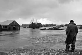 Surveying the damage in the Netherlands of the 1953 flood  	                                 CO ZEYLEMAKER/AFP via Getty Images