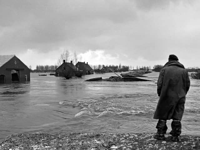 Surveying the damage in the Netherlands of the 1953 flood  	                                 CO ZEYLEMAKER/AFP via Getty Images