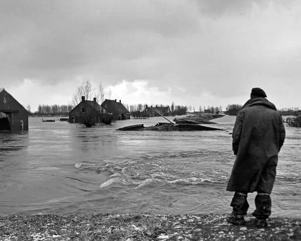 Surveying the damage in the Netherlands of the 1953 flood  	                                 CO ZEYLEMAKER/AFP via Getty Images