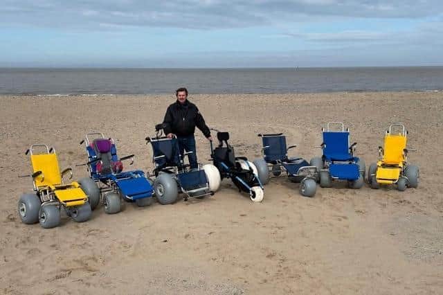 Mick Gray with some of the special beach wheelchairs