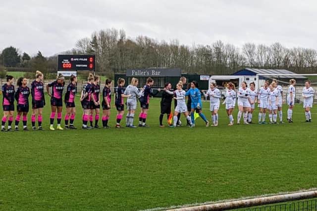 The Fylde and Forest teams shake hands before kick-off