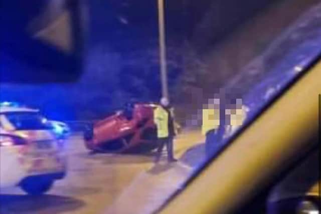 The crash on the Amounderness Way roundabout near Morrisons in Cleveleys saw a red Vauxhall Corsa overturn and land on its roof, whilst another car smashed into island