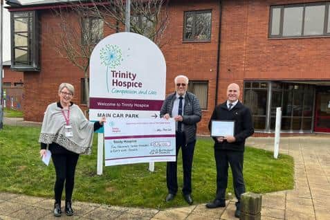 Nigel Dunnington, franchisee, handing over a £5,741 cheque to Trinity Hospice in Bispham.