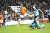Nathan Delfouneso scores the second of his two goals