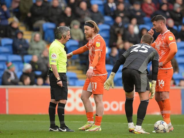 Josh Bowler remonstrates with the referee after being booked for an apparent dive