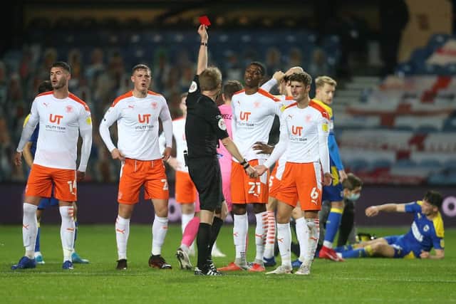 Ethan Robson was sent off as Blackpool ended the game with nine men
