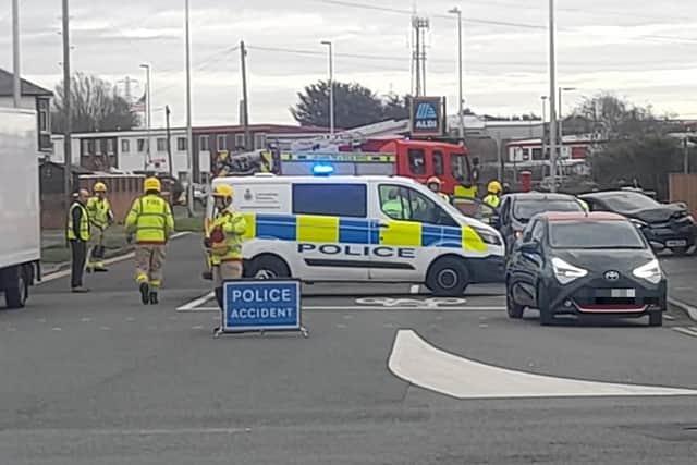 Police shut the junction outside Aldi in Holyoake Avenue whilst fire crews helped a casualty trapped inside one of the cars. Pic credit: David Bailey