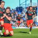 Paddy Lane (left) celebrates scoring Fleetwood's third goal at Portsmouth with Callum Camps
:Picture: SAM FIELDING / PRiME MEDIA IMAGES
