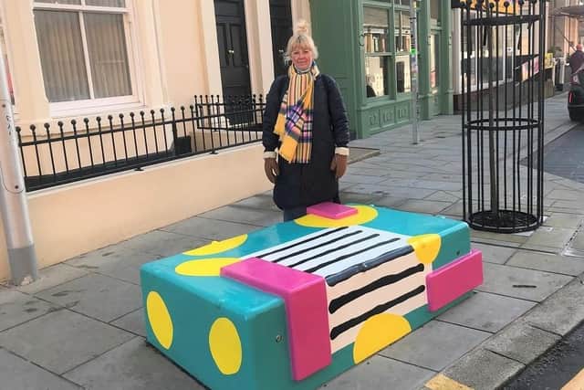 Artist Tina Dempsey with the new bench in Blackpool town centre