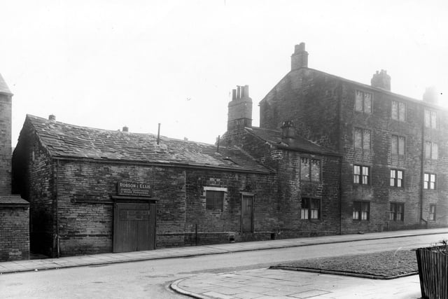 Eightlands Lane seen from the junction with Eightlands Avenue in February 1960. The single storey building on the left is the workshop premises of Robson & Ellis, joiners, undertakers and house furnishers.