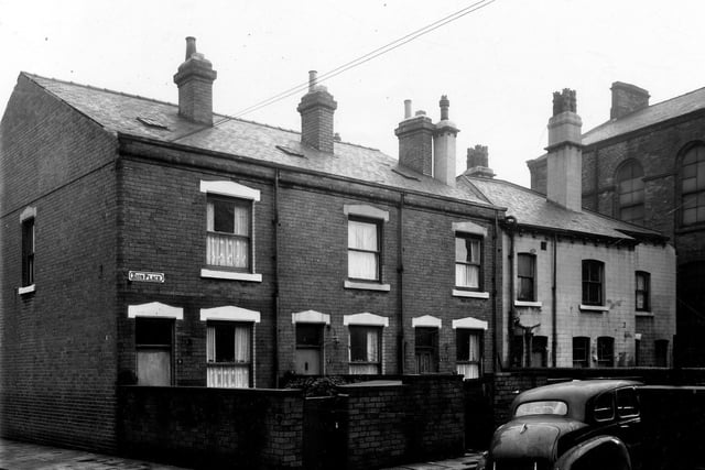 Zion Terrace in January 1961. Each through terrace has a private walled in yard,  On the left is Newport Street and on the far right the Joseph Street Methodist Church is visible.