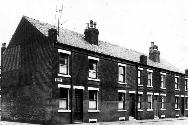 Lom View on the left and Windsor Terrace on the right originally built to house the shared outside toilet. Pictured in August 1963 ahead of demolition.