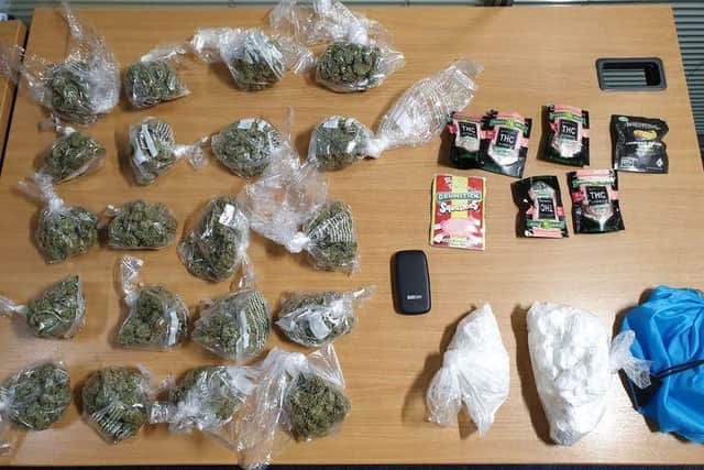 Bags of cannabis and cocaine were found stashed inside the vehicle, along with packets of sweets-flavoured synthetic cannabinoids and a mobile phone